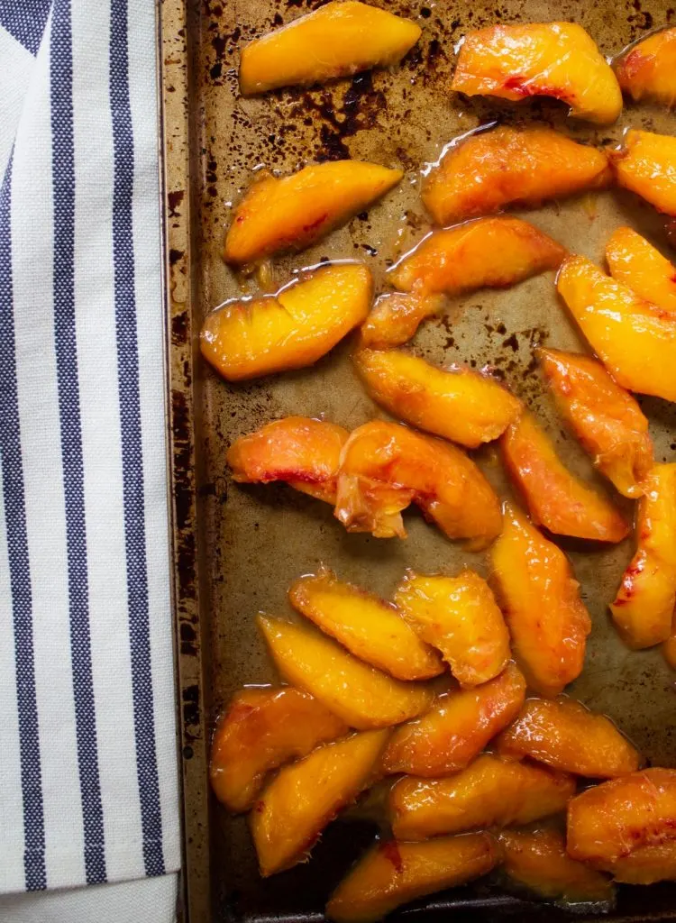 baking sheet of peeled fresh peaches