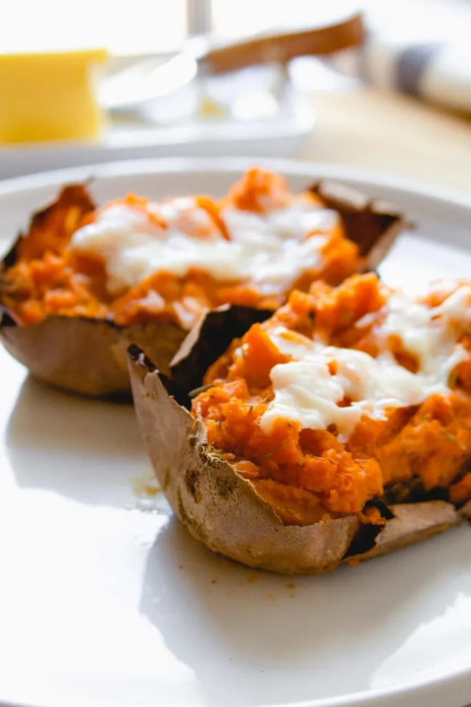 twice baked potato on white plate