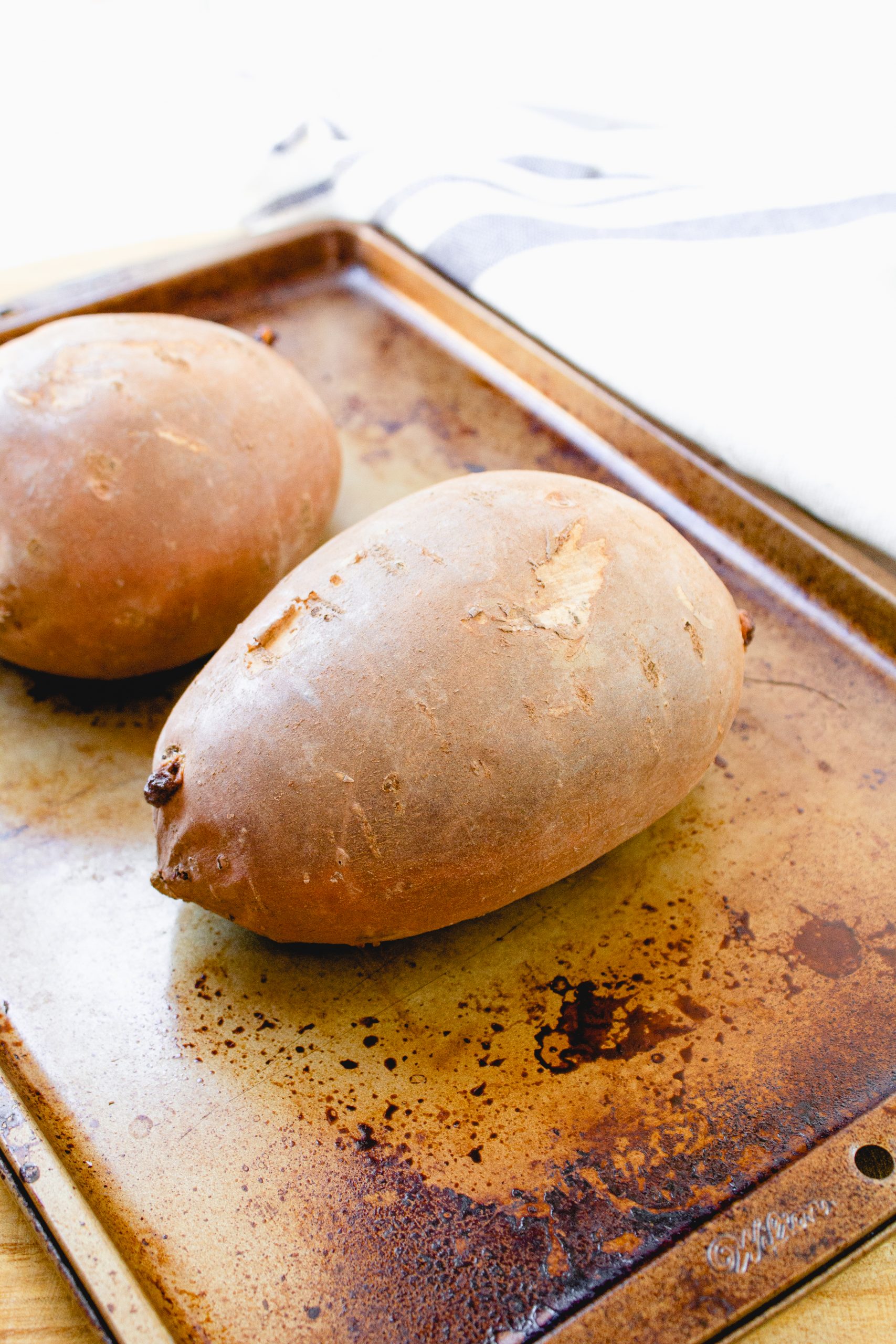 sweet potatoes on baking sheet